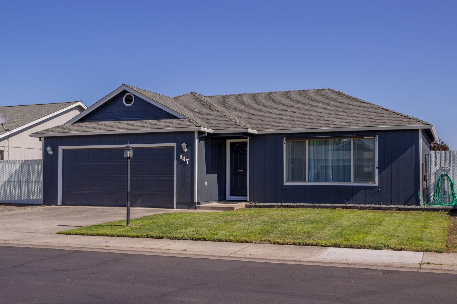 Suburban home with a driveway and attached garage