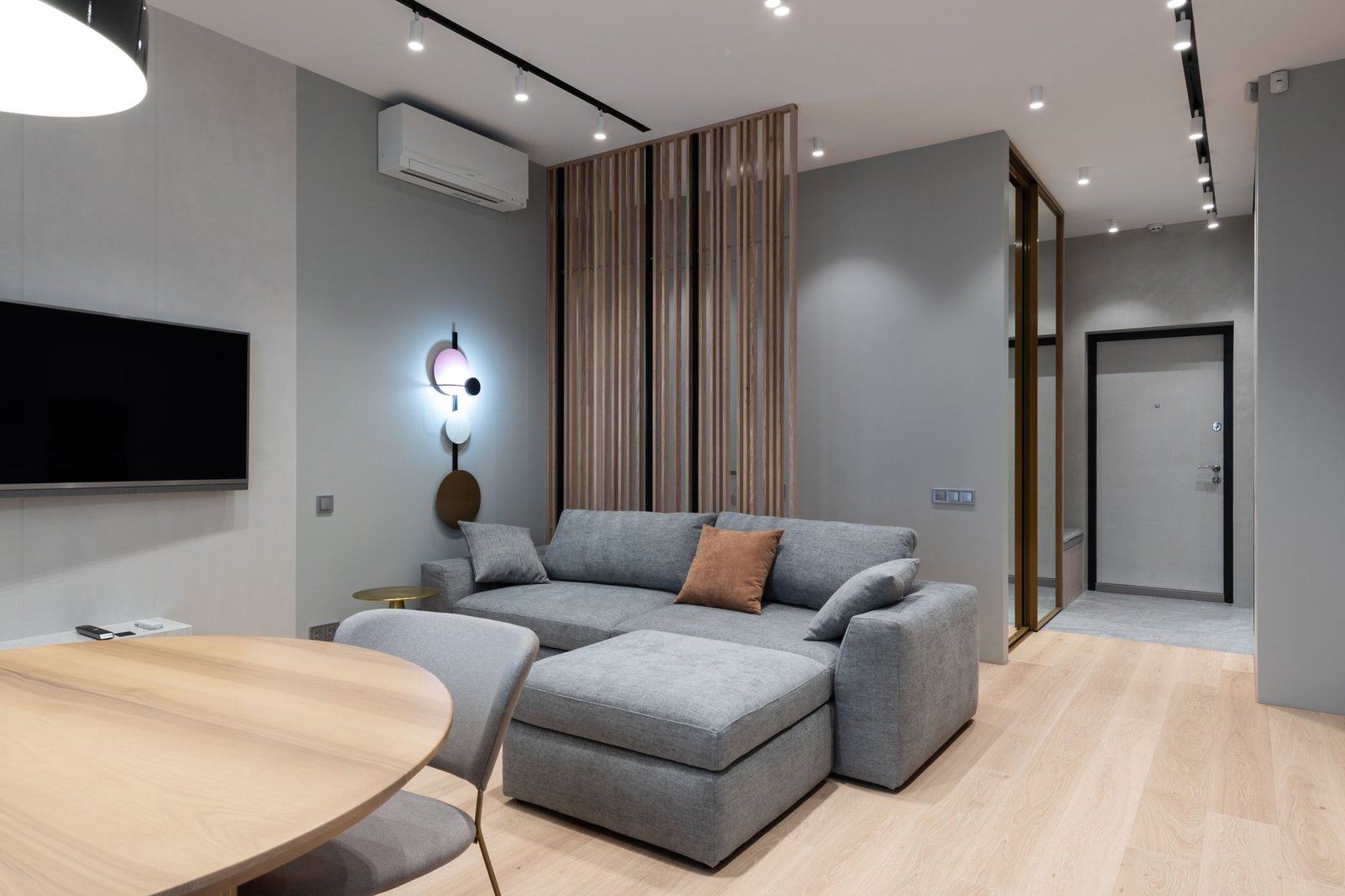 Comfortable living room interior with a gray sofa